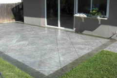 Stone-Edge-Surfaces-concrete-overlay-decorative-concrete-stamped-concretetexture-stamped-and-large-tile-patern-on-patio-4