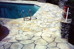 Stone-Edge-Surfaces-decorative-concrete-overlay-pool-deck-pool-deck-with-hand-carved-slate