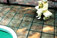 Stone-Edge-Surfaces-decorative-concrete-overlay-pool-deck-tile-look-swimming-pool-with-hand-carved-tile
